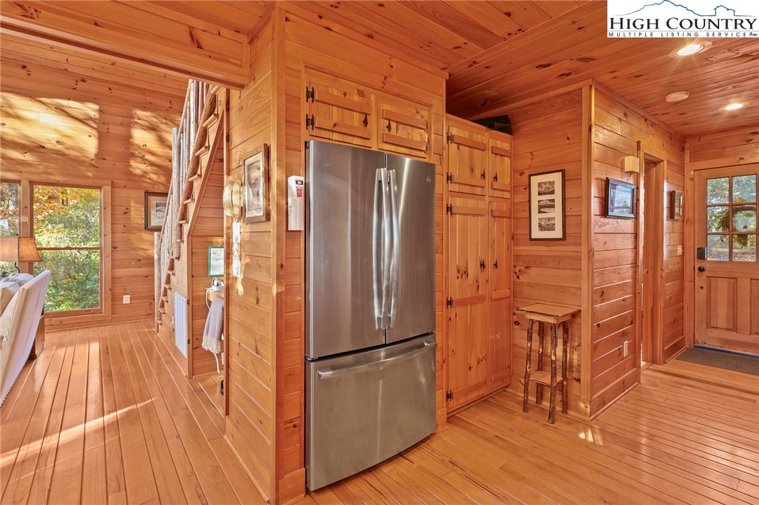 675 Cabin Ridge Road Ferguson, NC 28624 - Photo 18 of 50 a kitchen with stainless steel appliances granite countertop a refrigerator and wooden floor