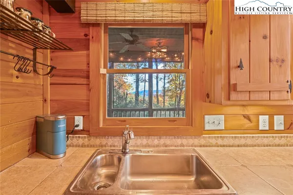 a bedroom with two beds and a chandelier