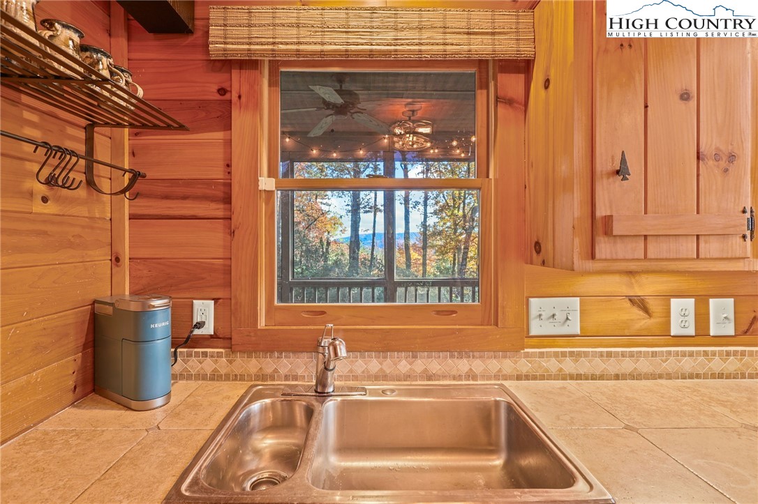675 Cabin Ridge Road Ferguson, NC 28624 - Photo 20 of 50 a bathroom with a sink and a bathtub
