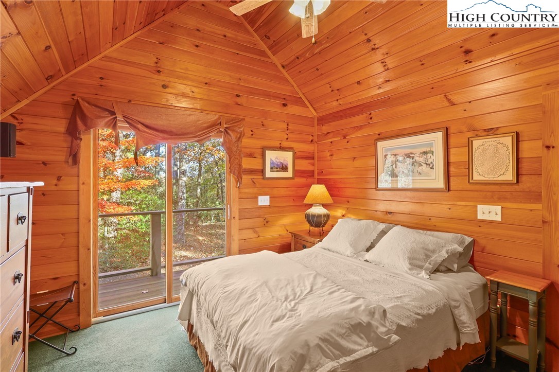 675 Cabin Ridge Road Ferguson, NC 28624 - Photo 32 of 50 a large bed sitting in a bedroom next to a window