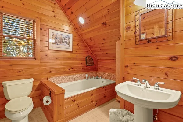 a bathroom with a bathtub and shower