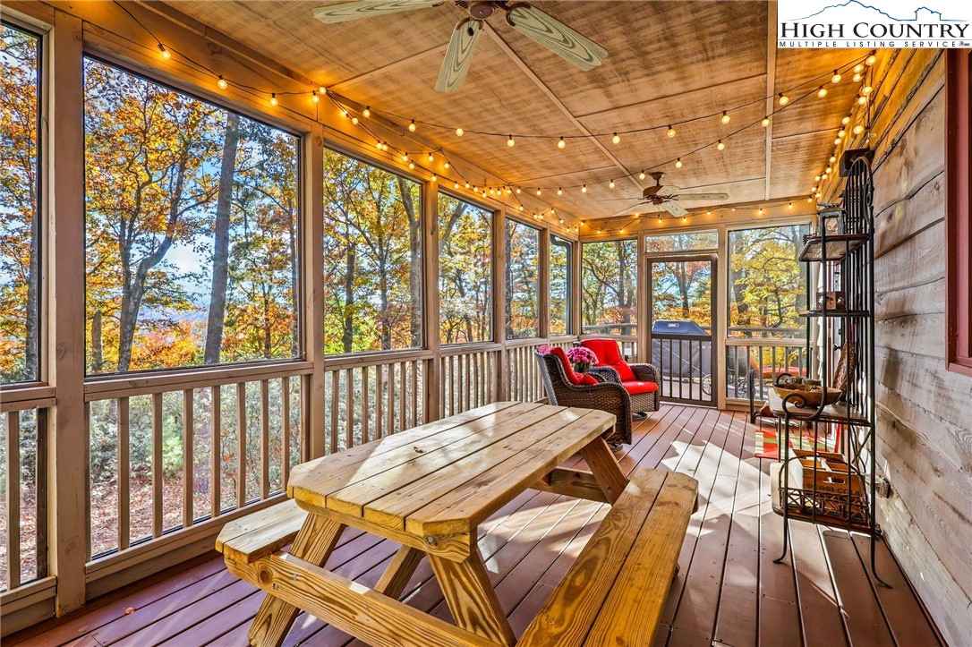 675 Cabin Ridge Road Ferguson, NC 28624 - Photo 35 of 50 a bed sitting in a bedroom next to a large window