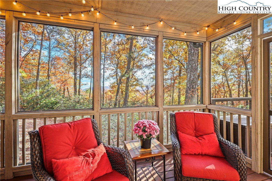 675 Cabin Ridge Road Ferguson, NC 28624 - Photo 36 of 50 a living room with furniture and a floor to ceiling window