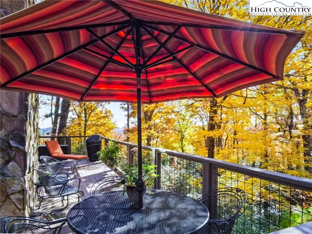 a view of balcony with furniture and wooden floor