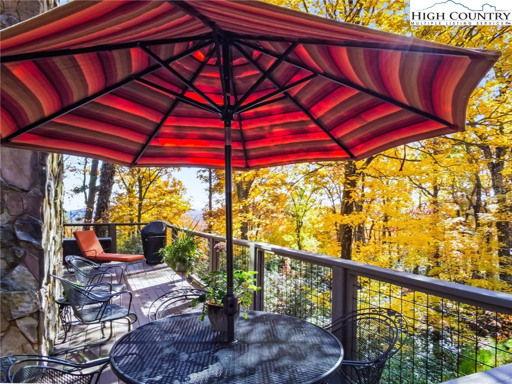 675 Cabin Ridge Road Ferguson, NC 28624 - Photo 37 of 50 a view of a balcony with furniture and wooden floor