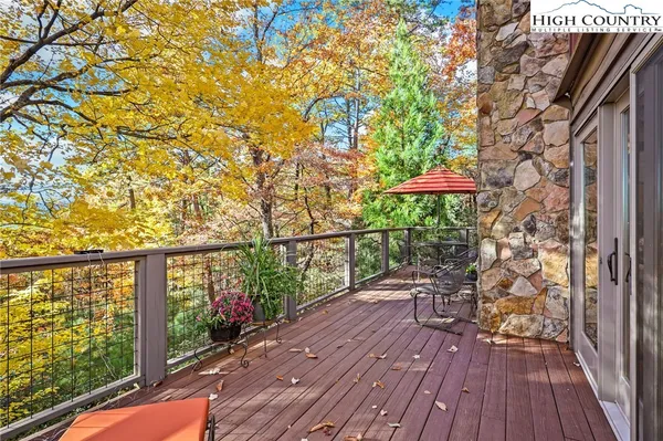 a view of outdoor space with deck and wooden floor