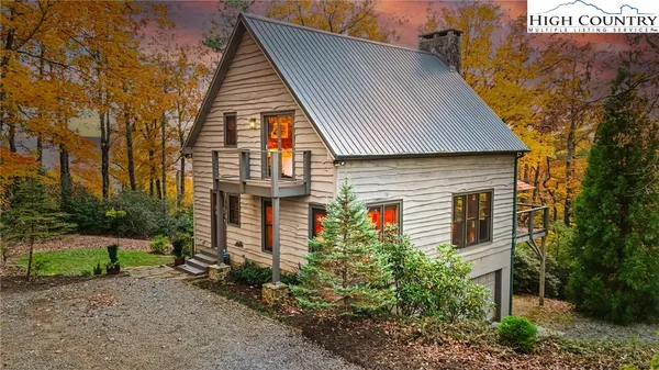 a view of a house with a tree