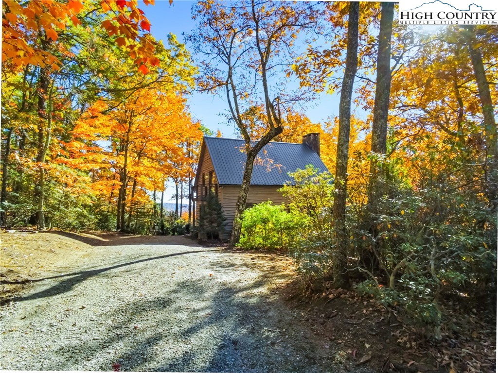 675 Cabin Ridge Road Ferguson, NC 28624 - Photo 6 of 50 a view of a house with a tree in the background