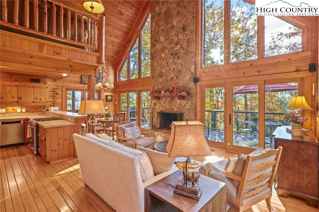 675 Cabin Ridge Road Ferguson, NC 28624 - Photo 8 of 50 a living room with fireplace furniture and a large window