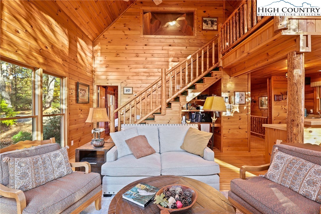 675 Cabin Ridge Road Ferguson, NC 28624 - Photo 9 of 50 a living room with furniture and a floor to ceiling window