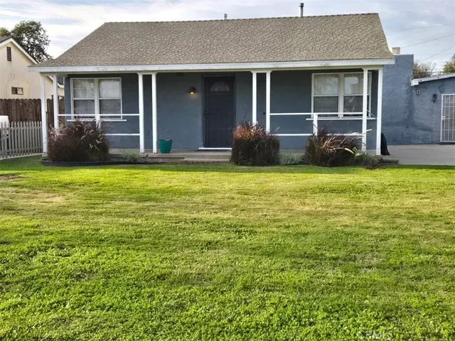 a backyard of a house with seating space