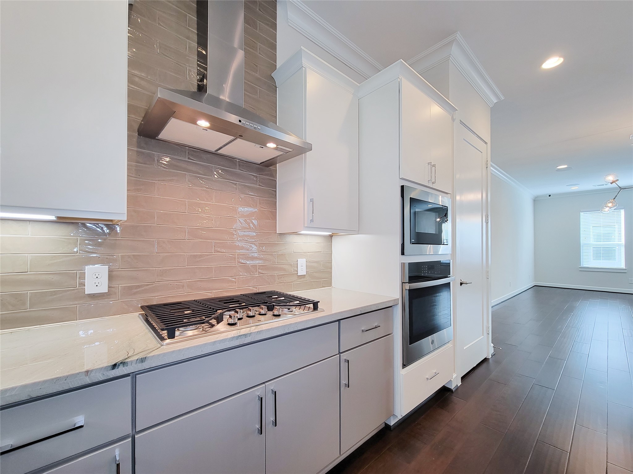 845 Fisher Street, Unit E Houston, TX 77018 - Photo 15 of 47 a kitchen with granite countertop a stove and a sink