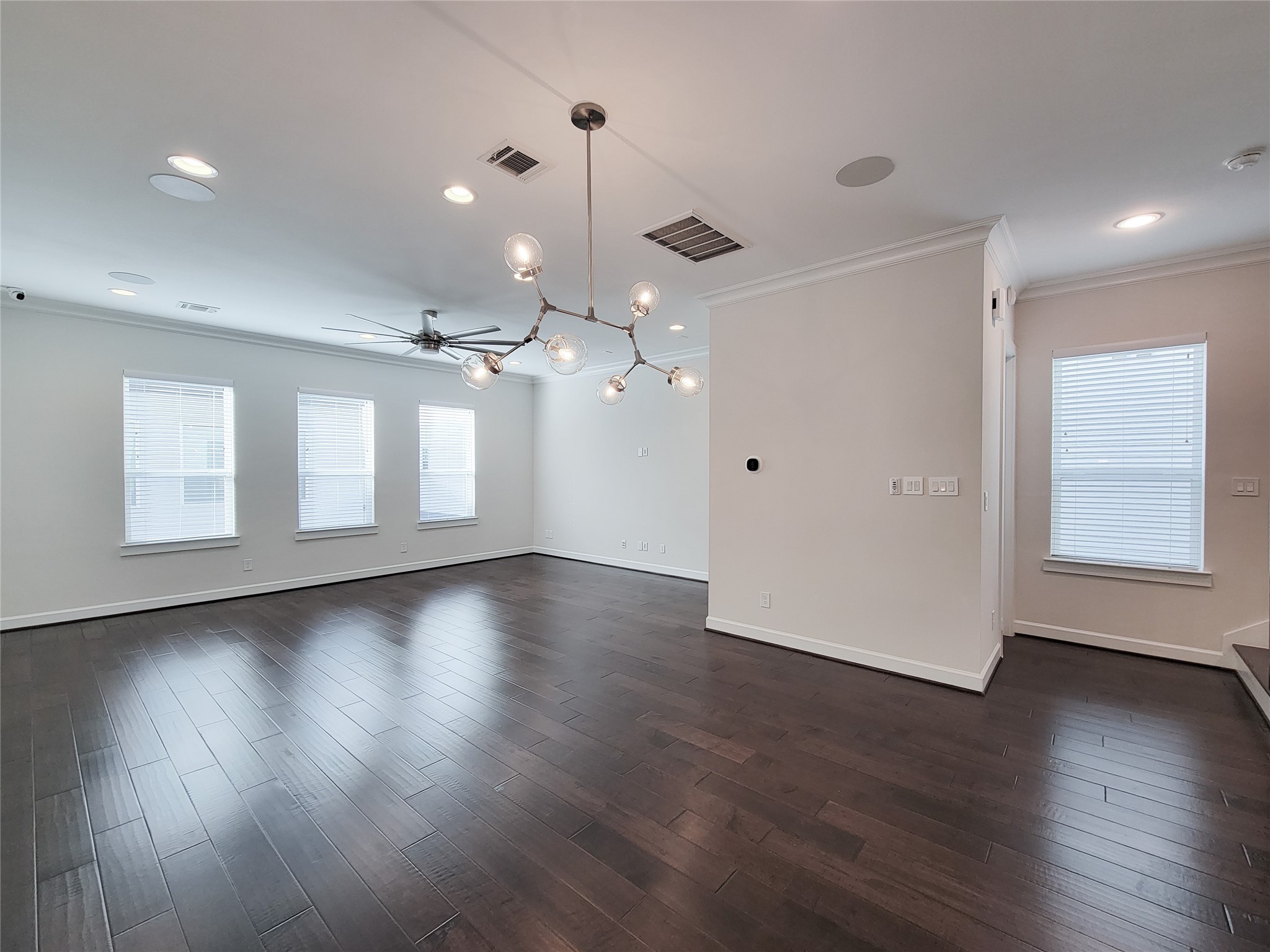 845 Fisher Street, Unit E Houston, TX 77018 - Photo 22 of 47 an empty room with wooden floor and windows