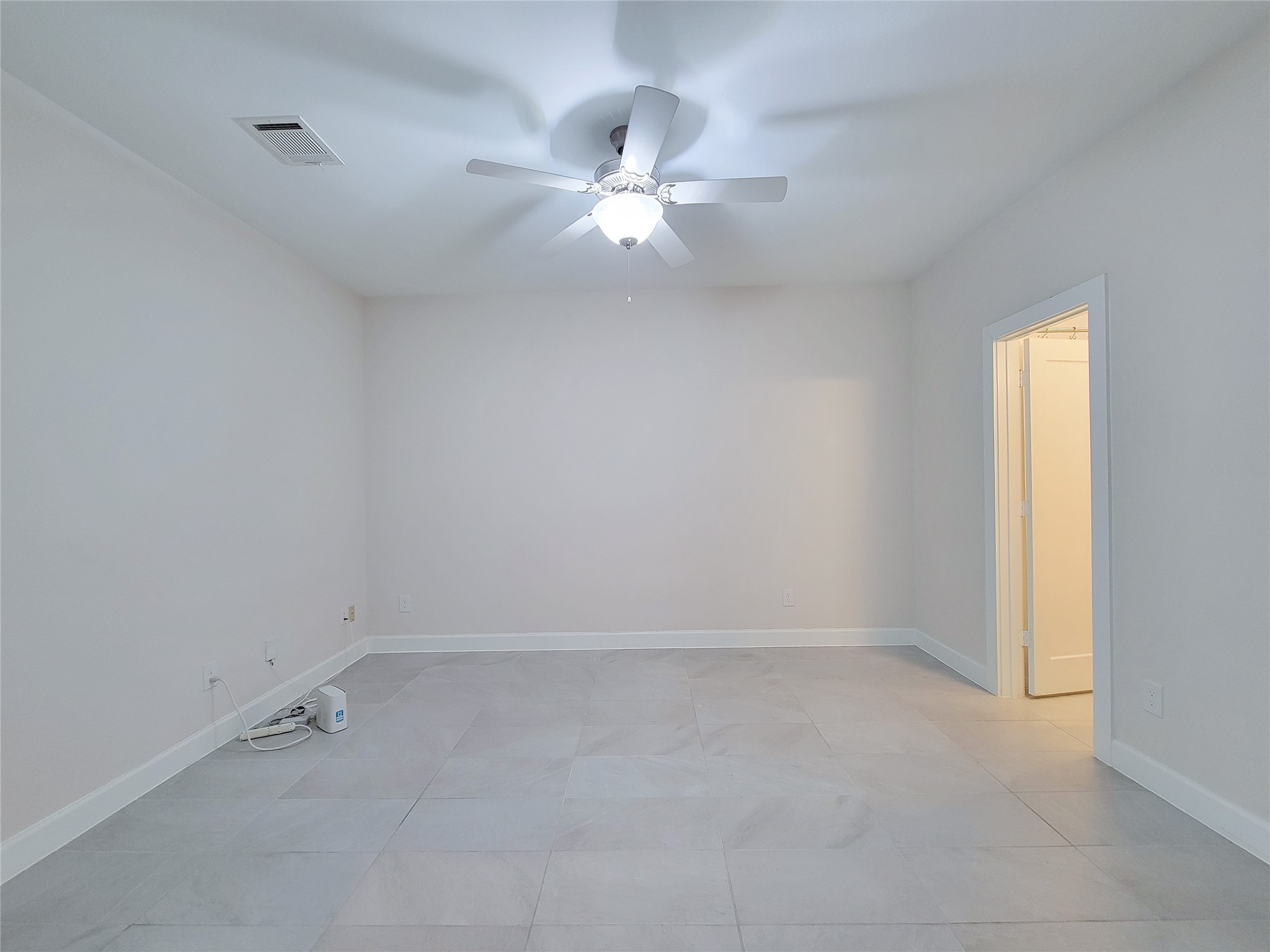 845 Fisher Street, Unit E Houston, TX 77018 - Photo 5 of 47 wooden floor in an empty room with a window