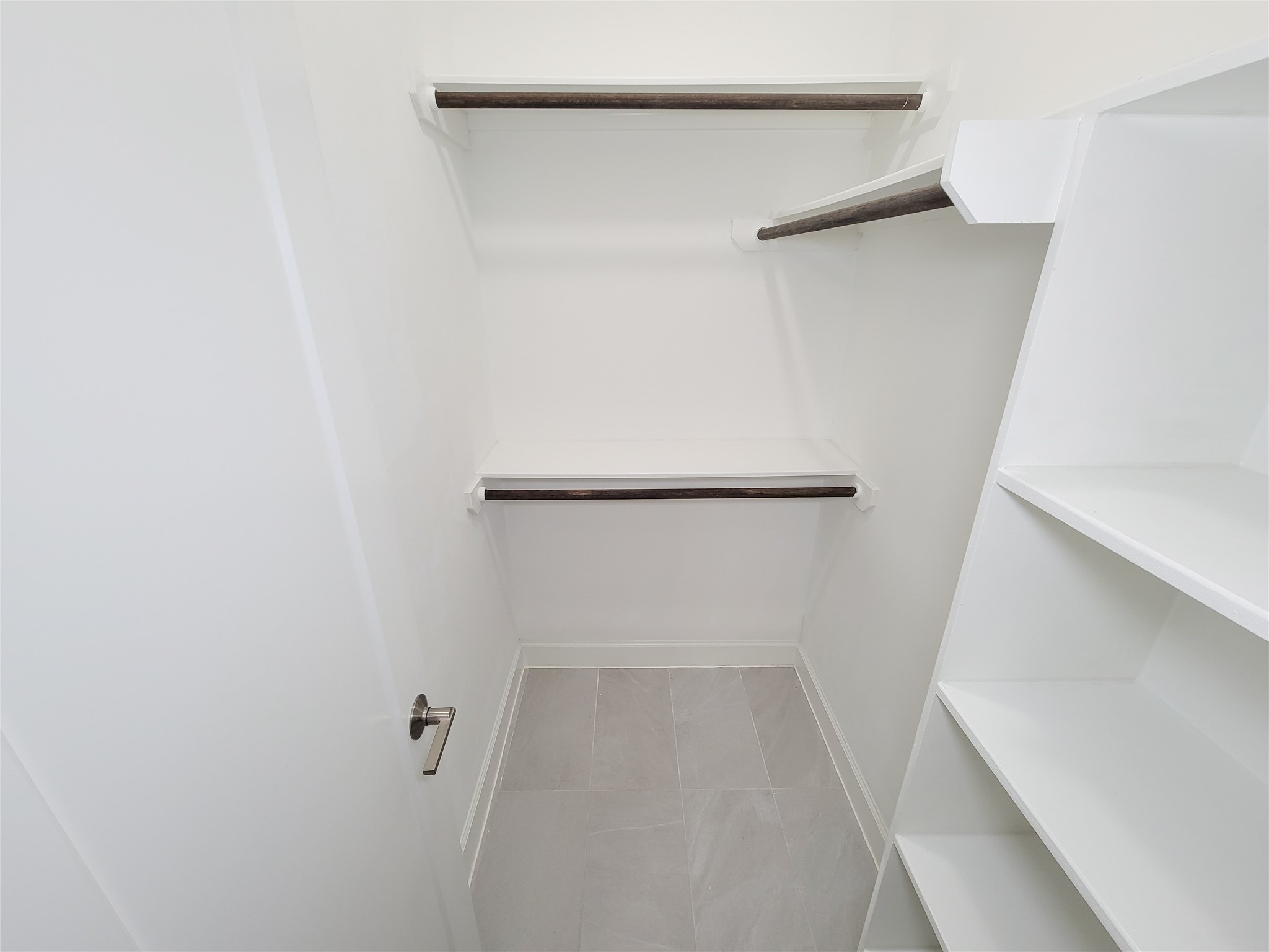 845 Fisher Street, Unit E Houston, TX 77018 - Photo 8 of 47 a view of walk in closet with empty racks