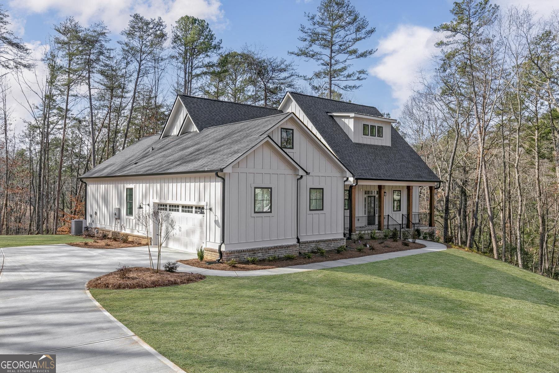 126 Birmingham Road Ball Ground, GA 30107 - Photo 1 of 1 a front view of a house with a yard