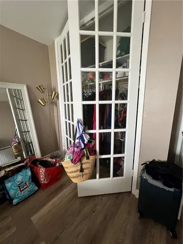 a bed room with a bed and a chair