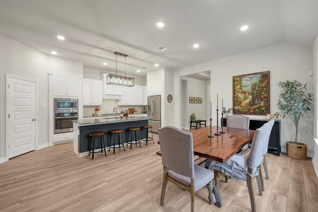 a dining room with furniture and window