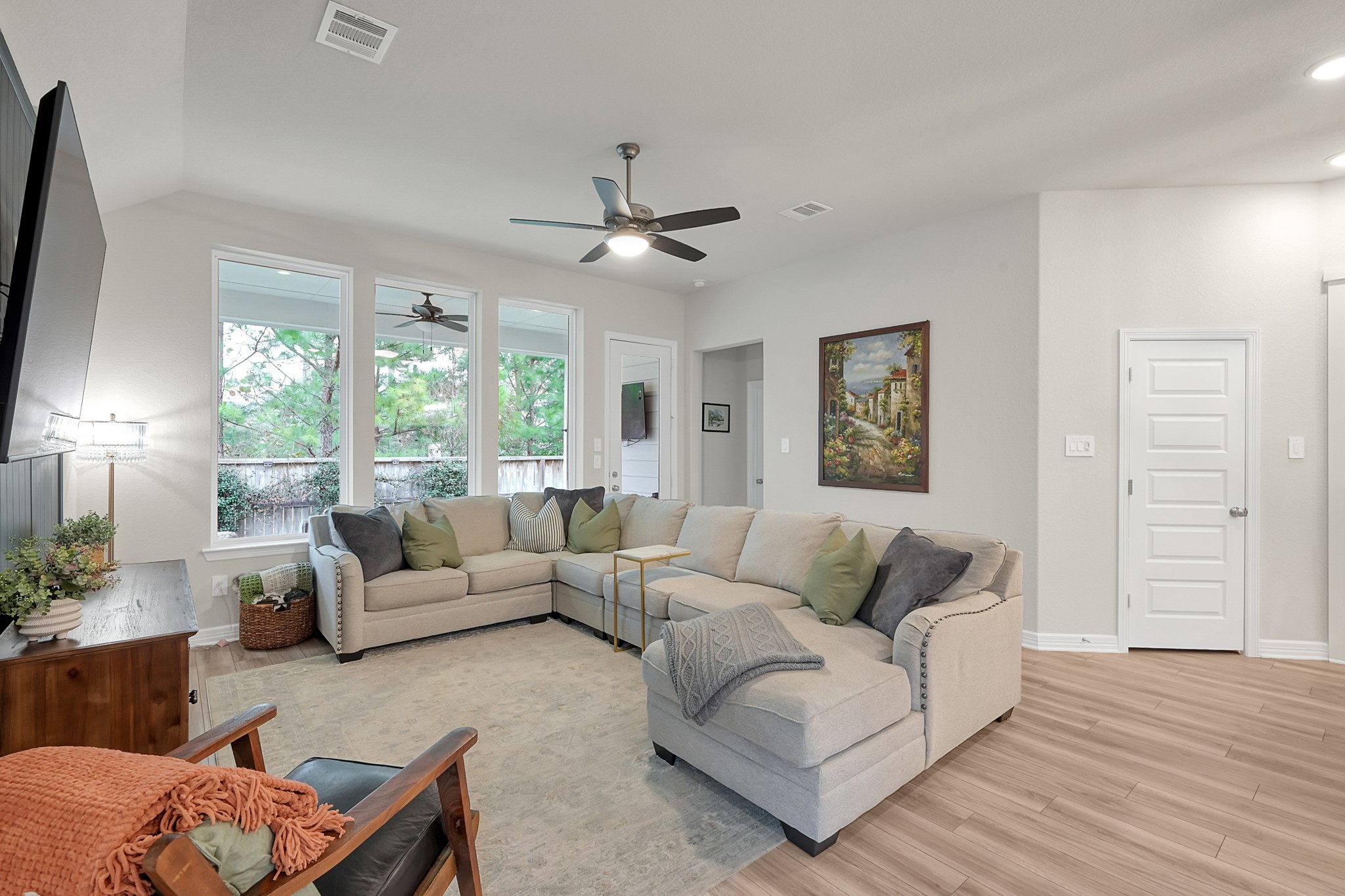 105 Dove Springs Court Conroe, TX 77304 - Photo 23 of 49 a living room with furniture and a large window