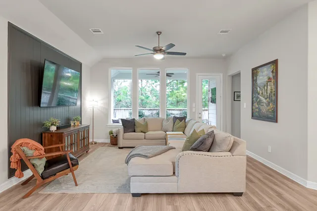 a living room with furniture and a large window