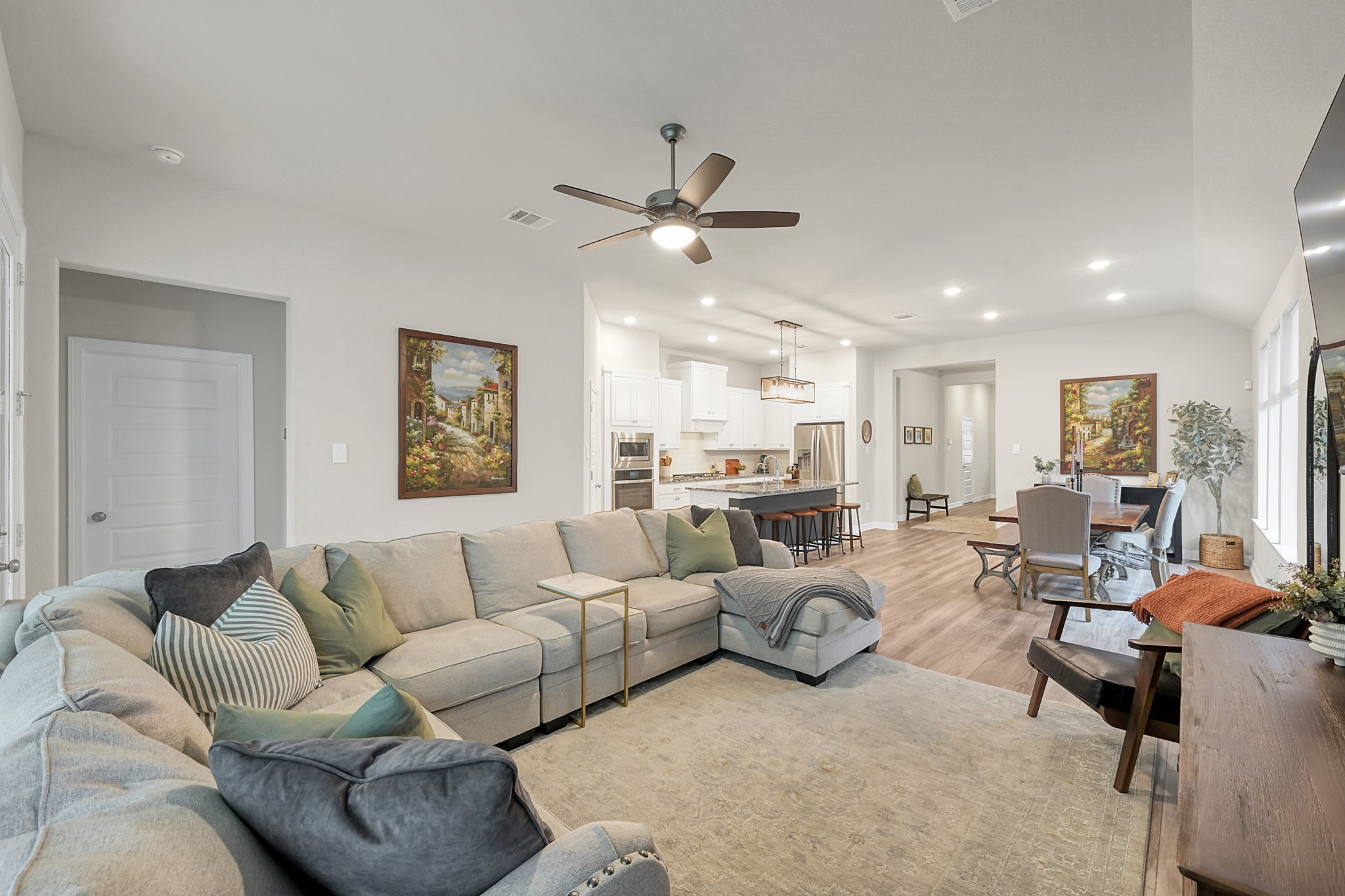 105 Dove Springs Court Conroe, TX 77304 - Photo 27 of 49 a living room with furniture ceiling fan and a rug