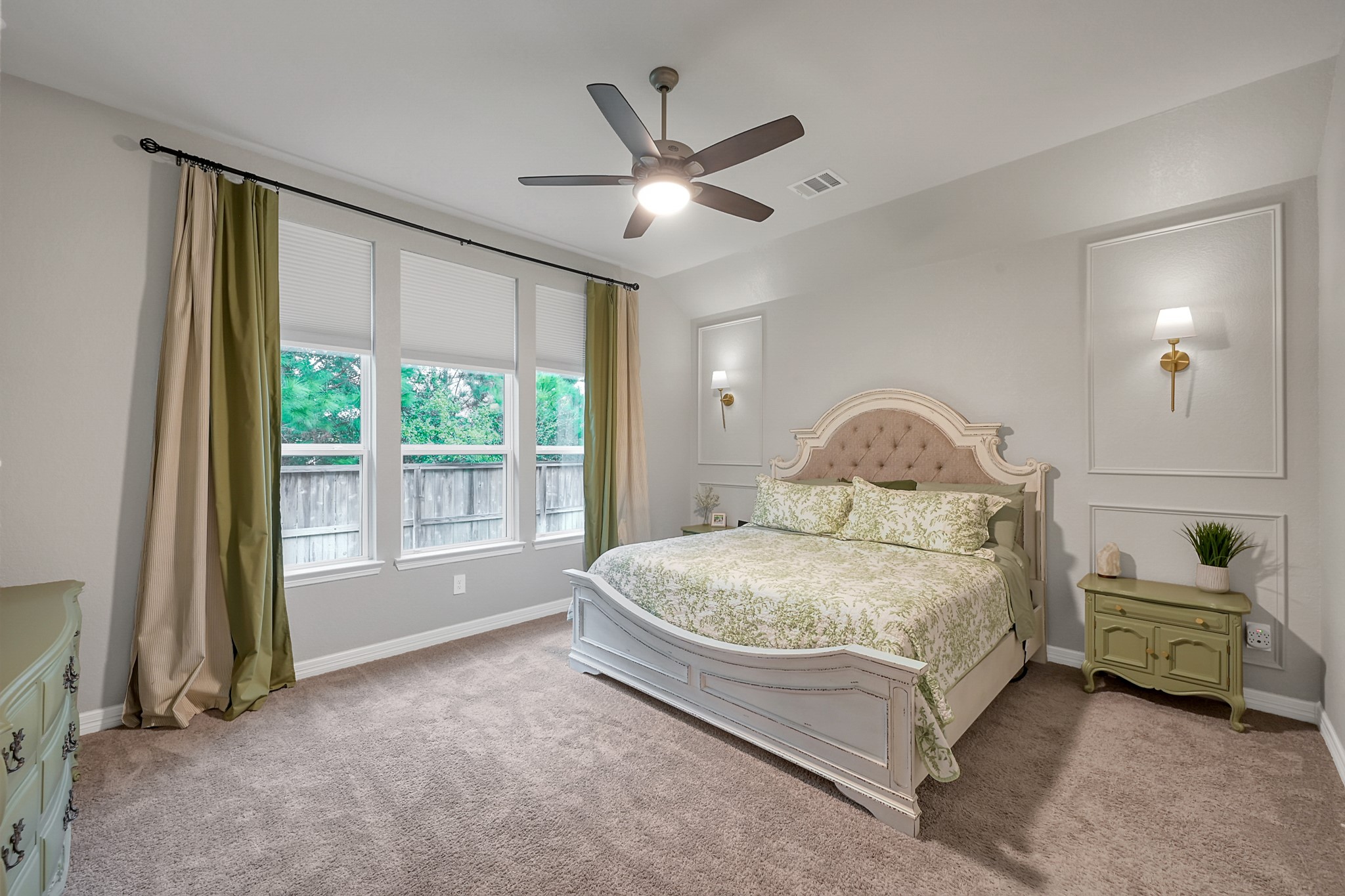 105 Dove Springs Court Conroe, TX 77304 - Photo 28 of 49 a spacious bedroom with a bed and a large window