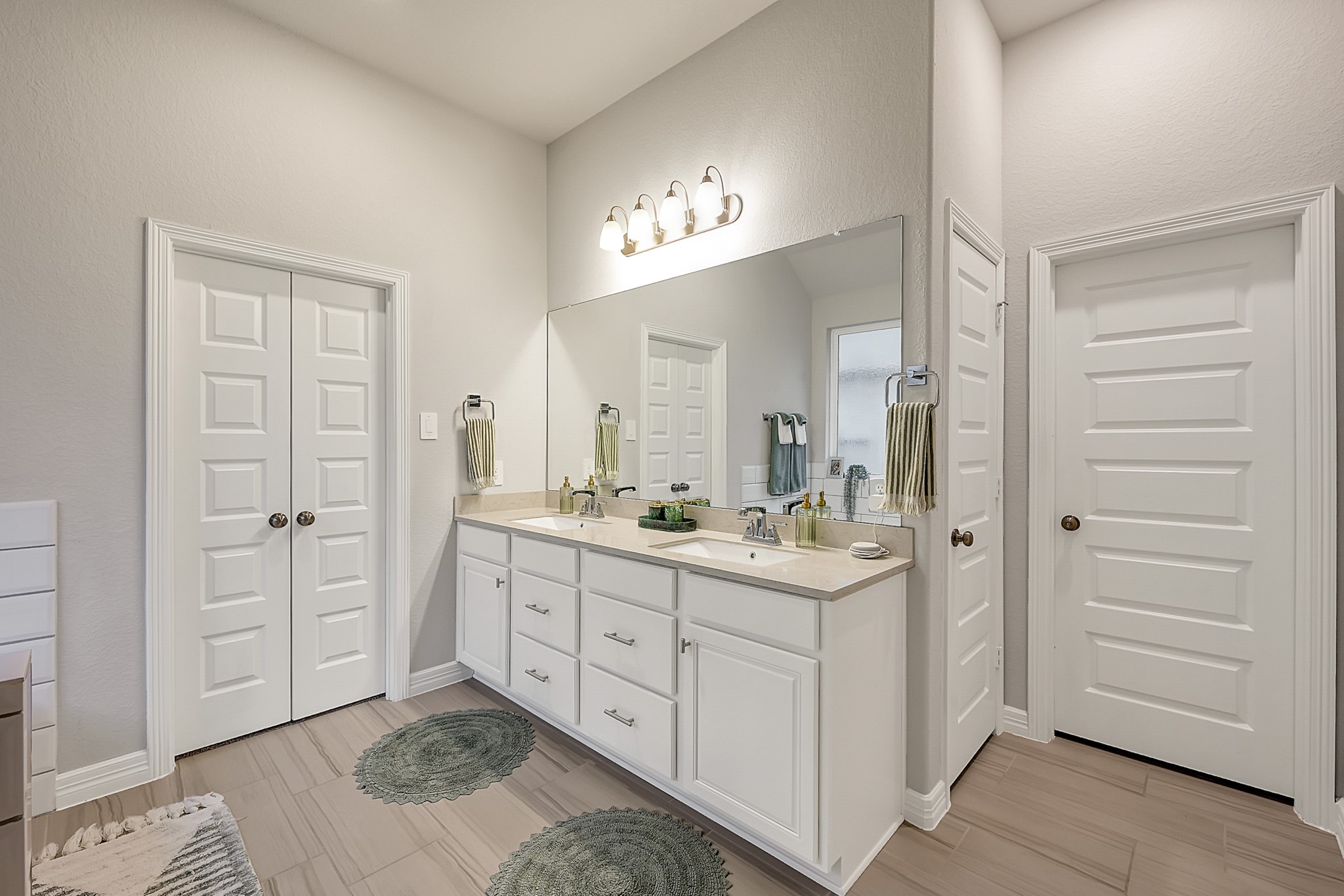 105 Dove Springs Court Conroe, TX 77304 - Photo 29 of 49 a spacious bathroom with a granite countertop sink a mirror and a