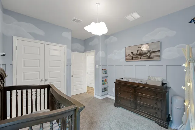 a view of a bedroom with furniture and staircase