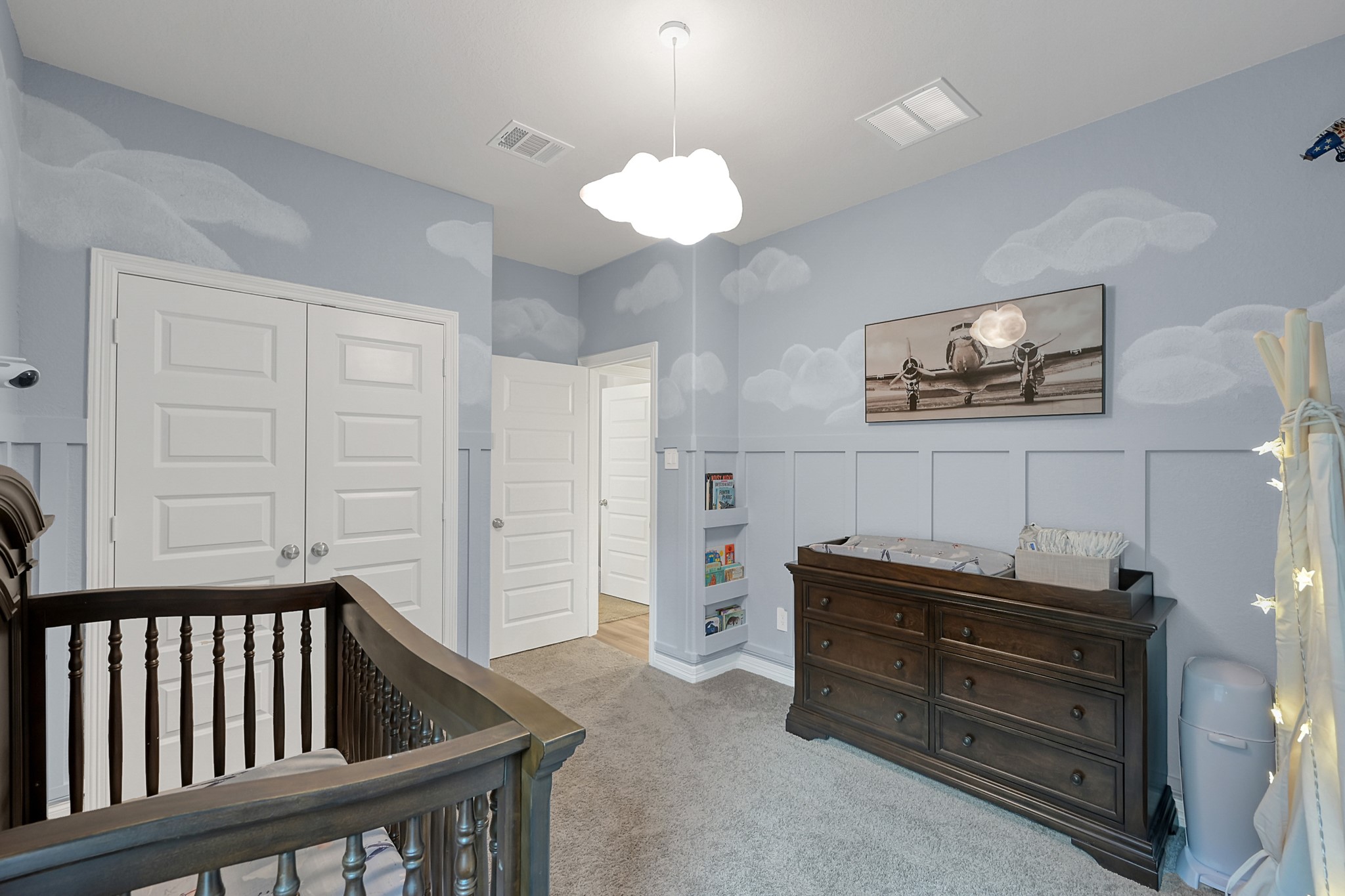 105 Dove Springs Court Conroe, TX 77304 - Photo 33 of 49 a living room with furniture and a chandelier