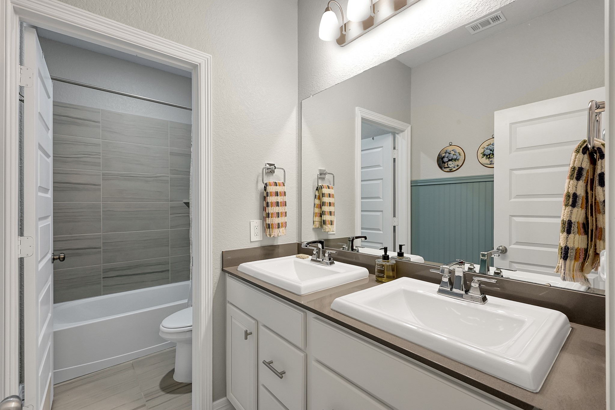 105 Dove Springs Court Conroe, TX 77304 - Photo 34 of 49 a bathroom with a sink a toilet and shower