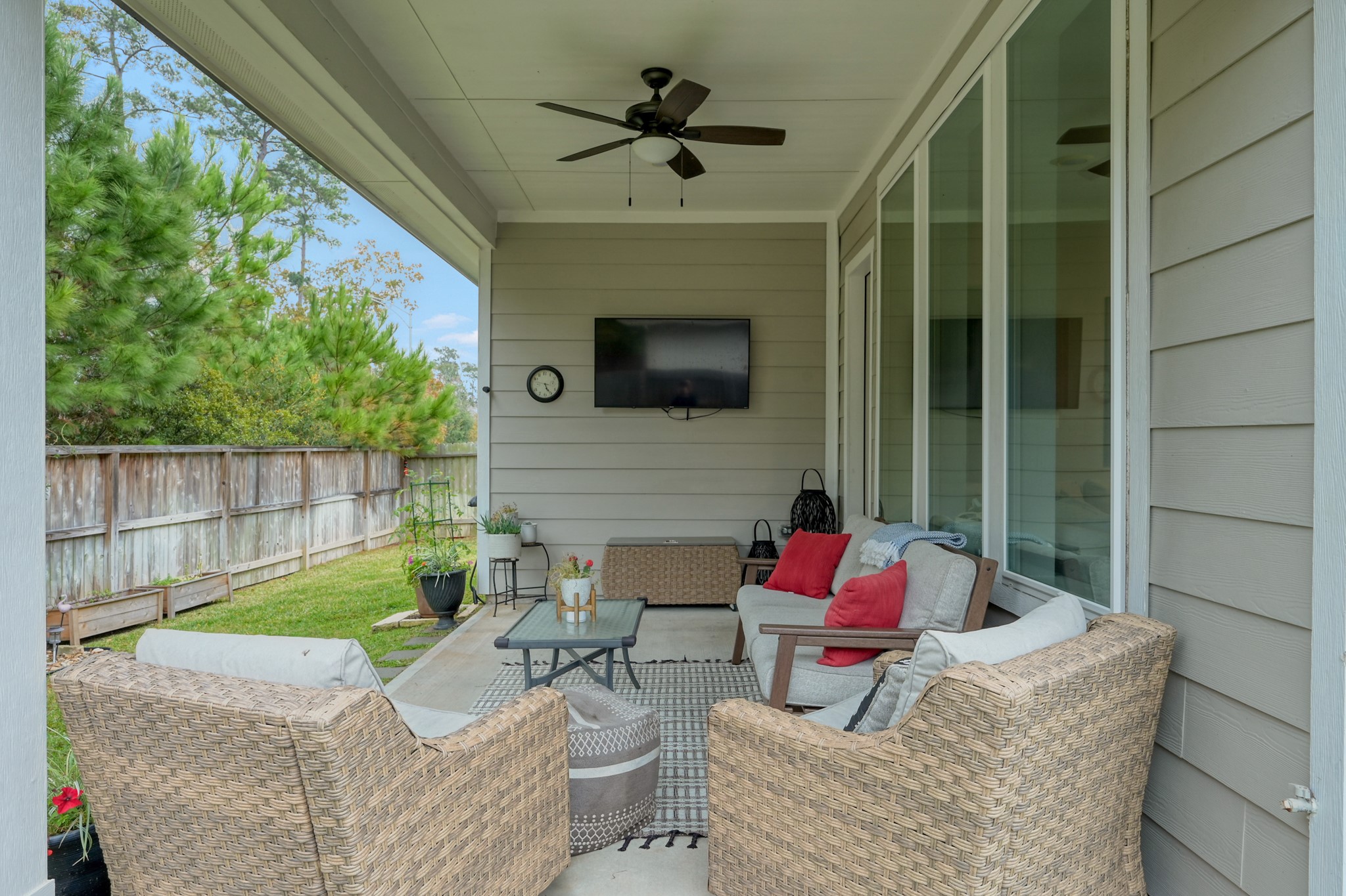 105 Dove Springs Court Conroe, TX 77304 - Photo 38 of 49 a living room with furniture and a flat screen tv