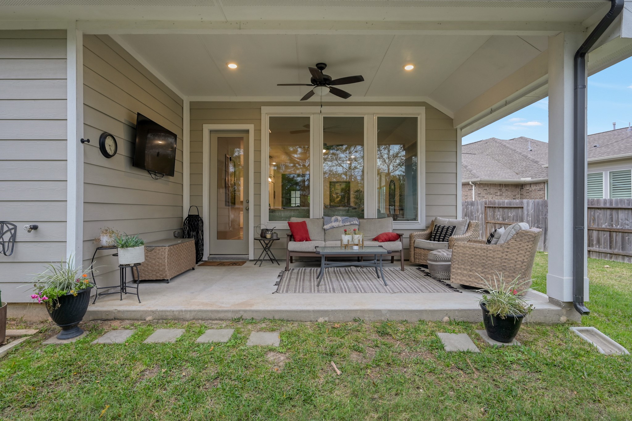105 Dove Springs Court Conroe, TX 77304 - Photo 39 of 49 a view of a patio with chair and tables back yard of the house