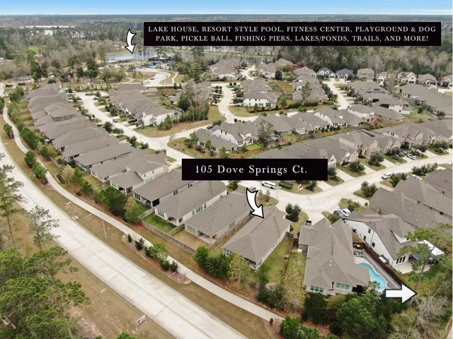 a view of a swimming pool with furniture