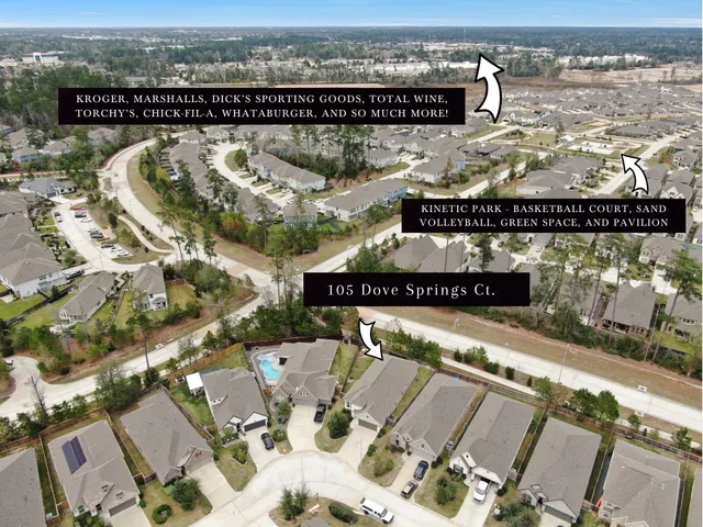 an aerial view of a house with a garden and lake view