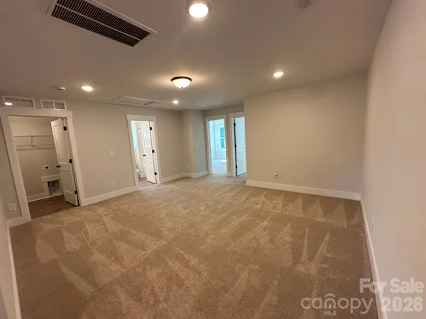 a bathroom with a double vanity sink and mirror