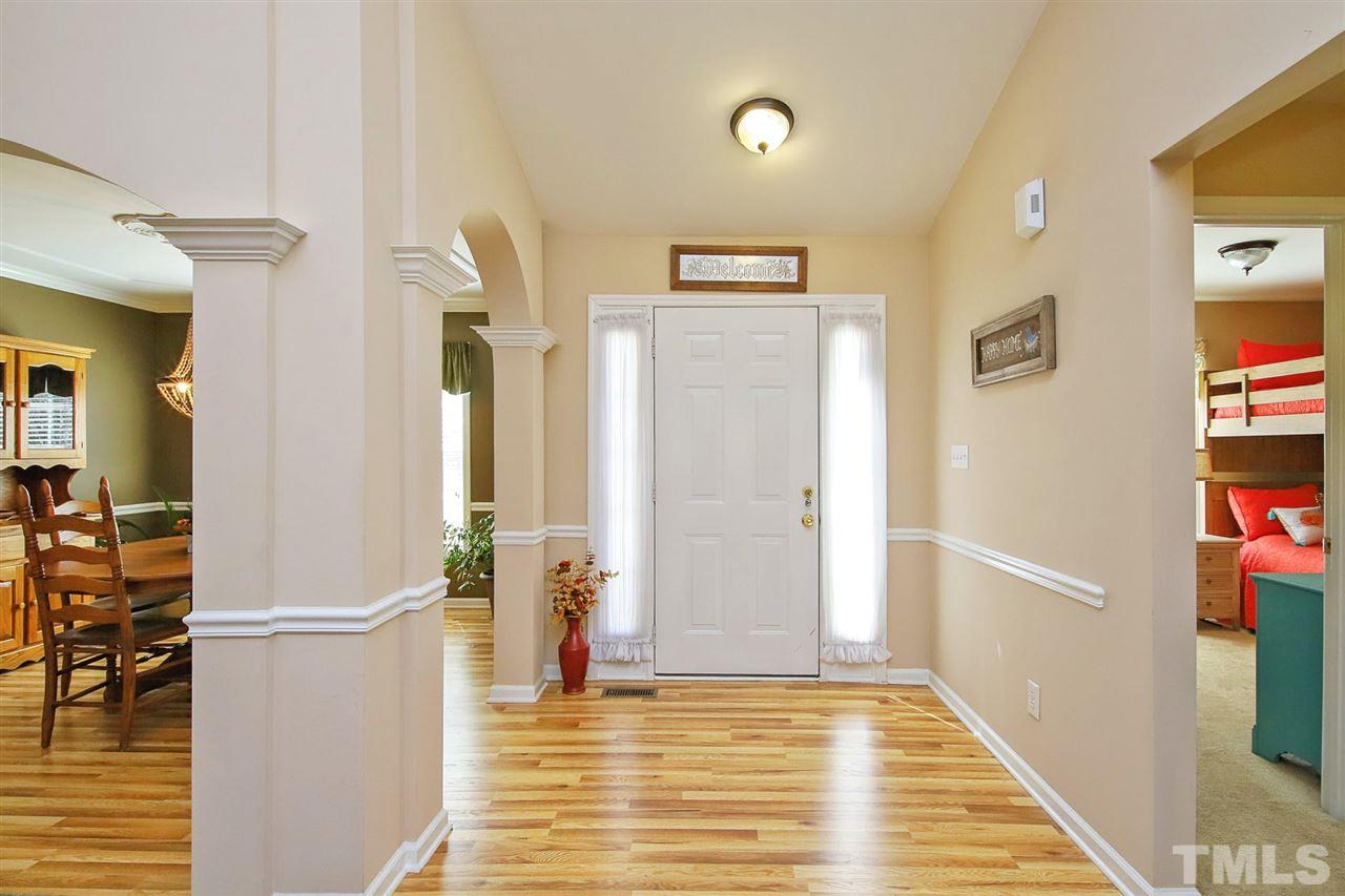 200 Melksham Road Wake Forest, NC 27587 - Photo 2 of 29 a view of a hallway with furniture and floor to ceiling window