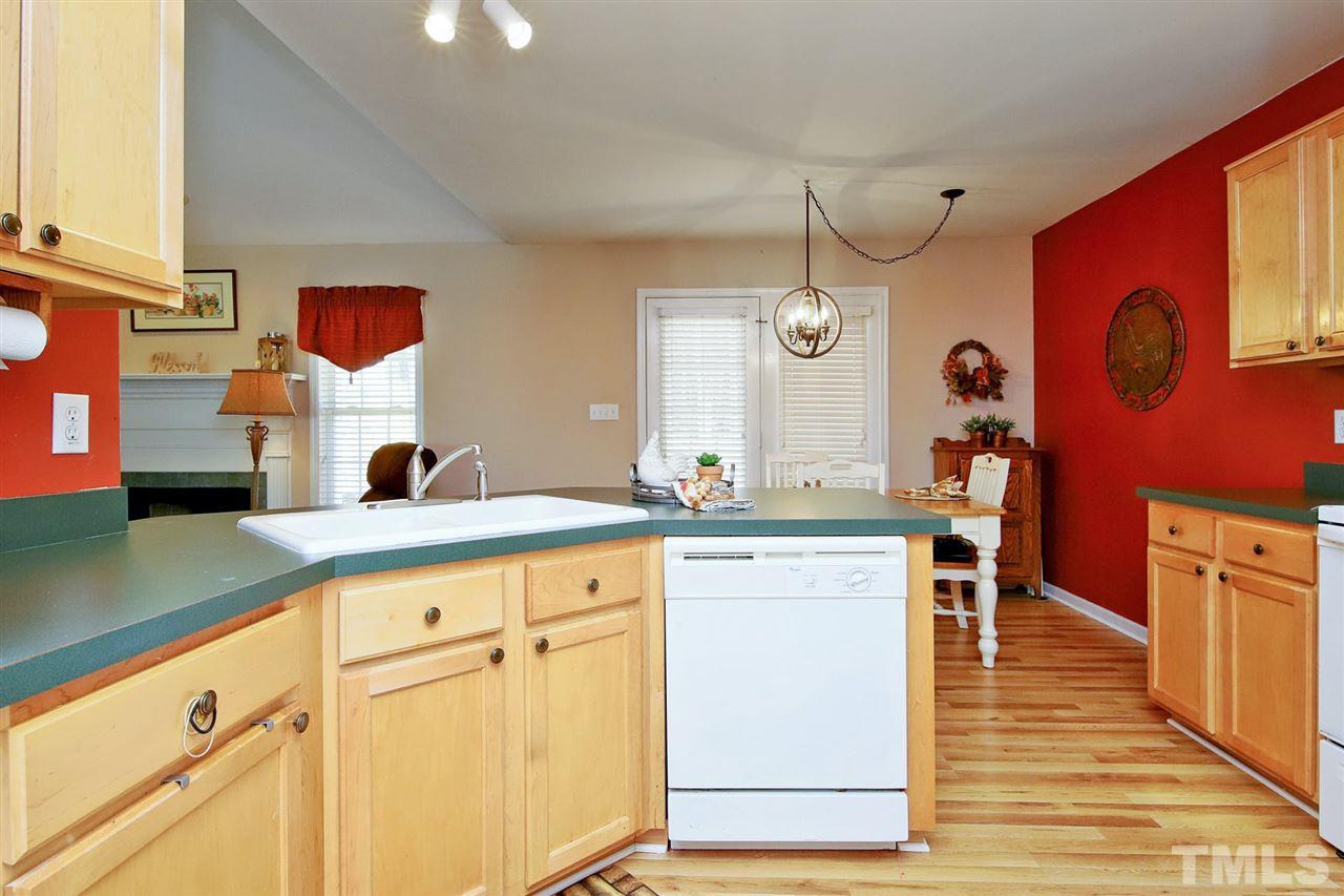 200 Melksham Road Wake Forest, NC 27587 - Photo 12 of 29 a kitchen with stainless steel appliances granite countertop a sink and cabinets