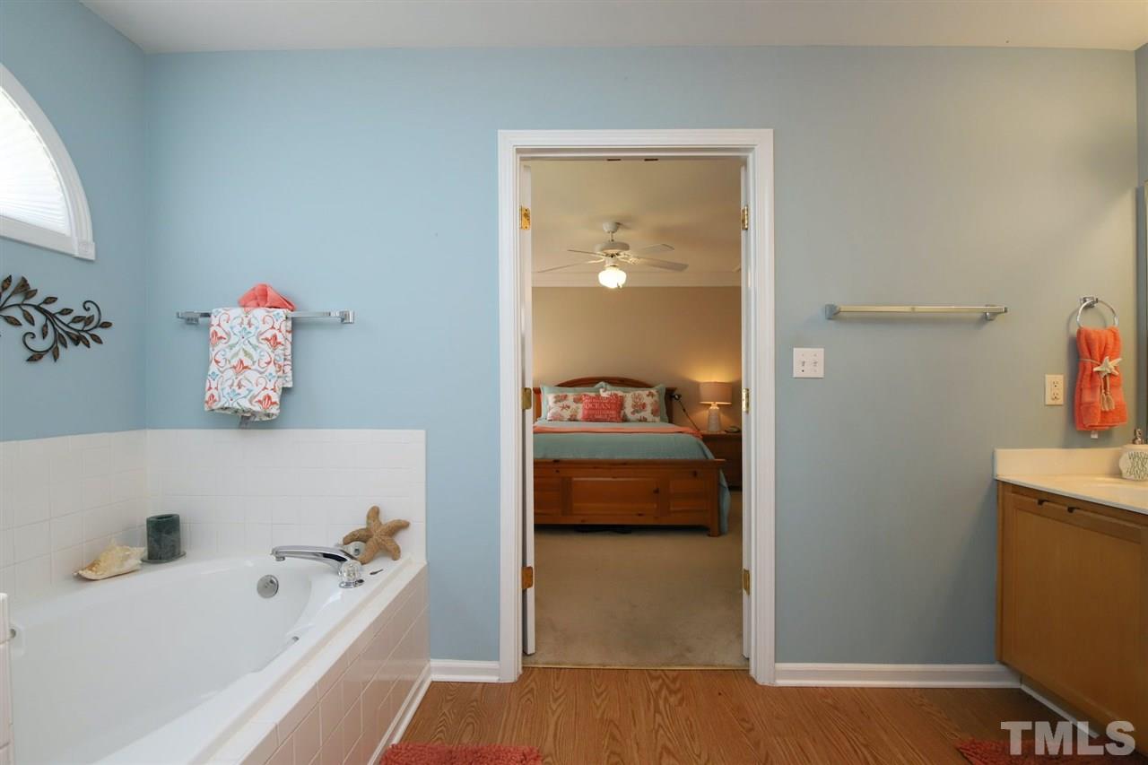 200 Melksham Road Wake Forest, NC 27587 - Photo 14 of 29 a en suite spacious bathroom with a tub and mirror