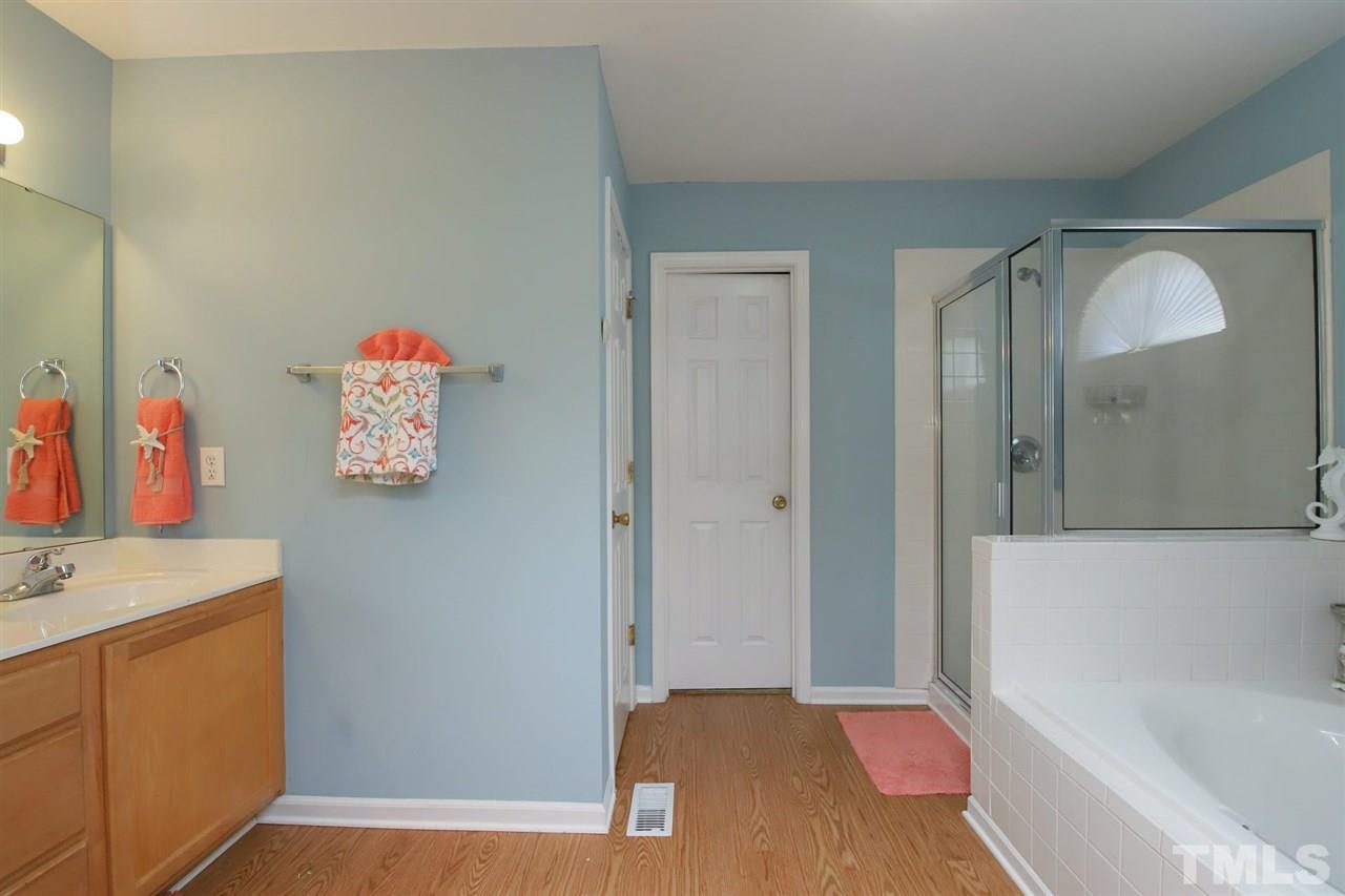 200 Melksham Road Wake Forest, NC 27587 - Photo 15 of 29 a bedroom with a bed and a dresser