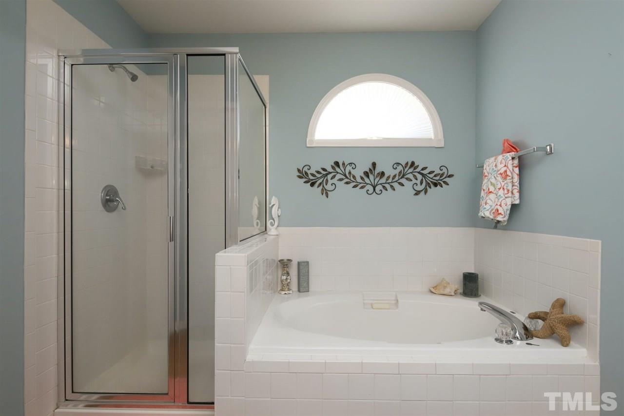 200 Melksham Road Wake Forest, NC 27587 - Photo 16 of 29 a bathroom with a tub and a window