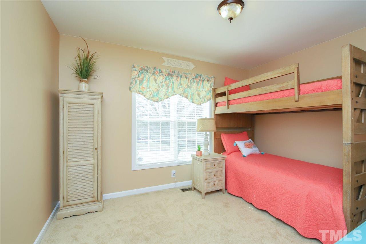 200 Melksham Road Wake Forest, NC 27587 - Photo 18 of 29 a bedroom with a bed and a window