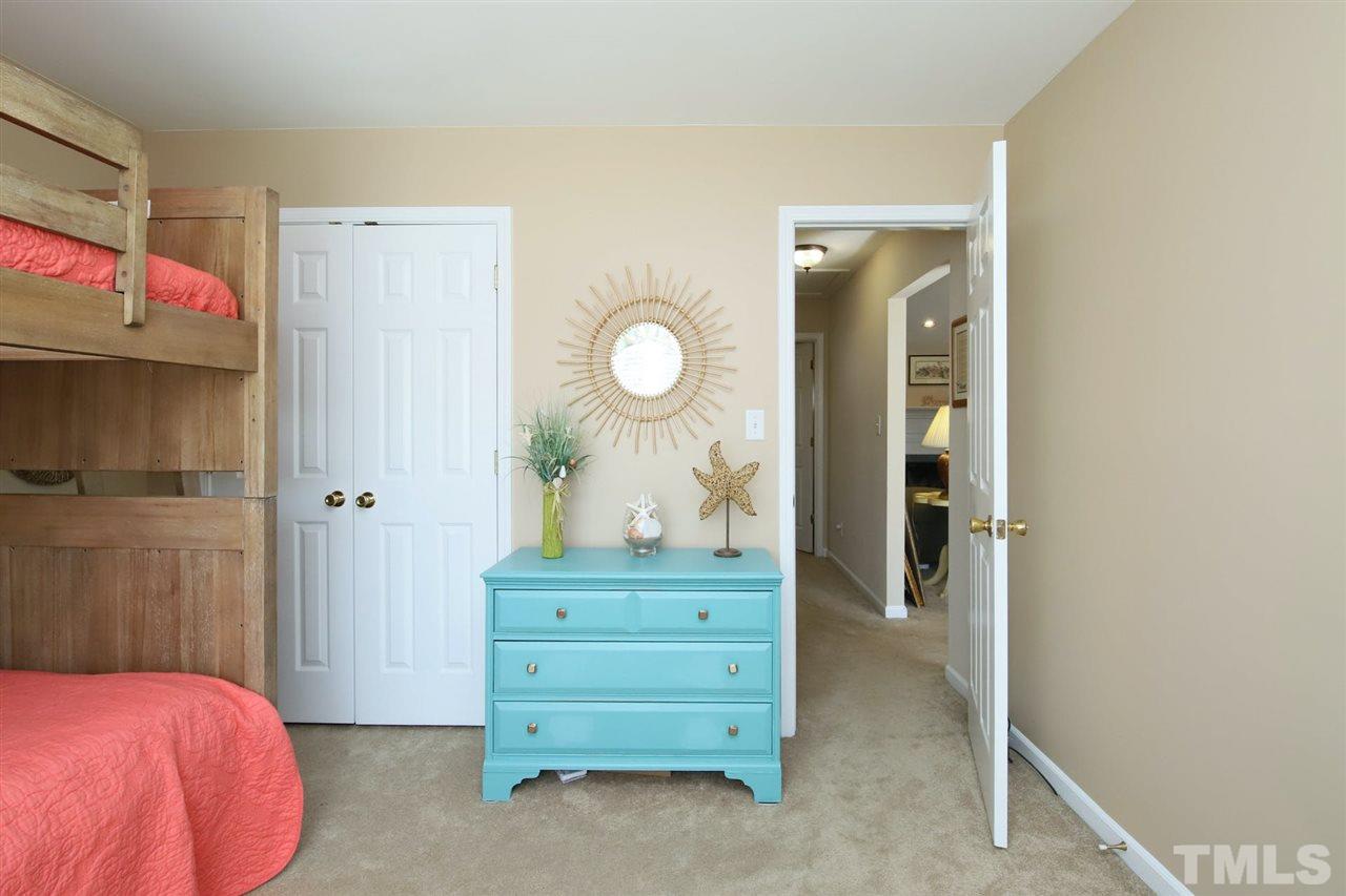 200 Melksham Road Wake Forest, NC 27587 - Photo 19 of 29 a bedroom with a bed and a dresser