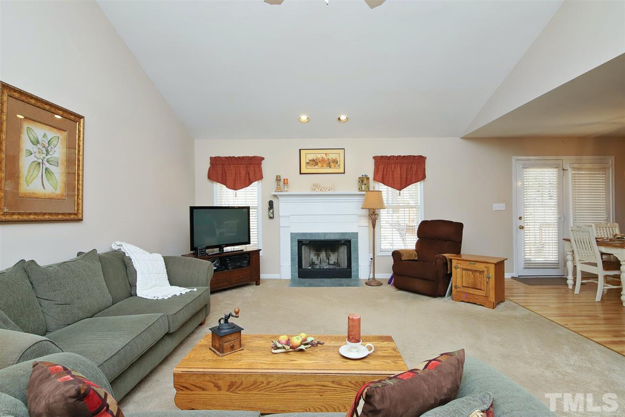 200 Melksham Road Wake Forest, NC 27587 - Photo 3 of 29 a living room with furniture and a fireplace