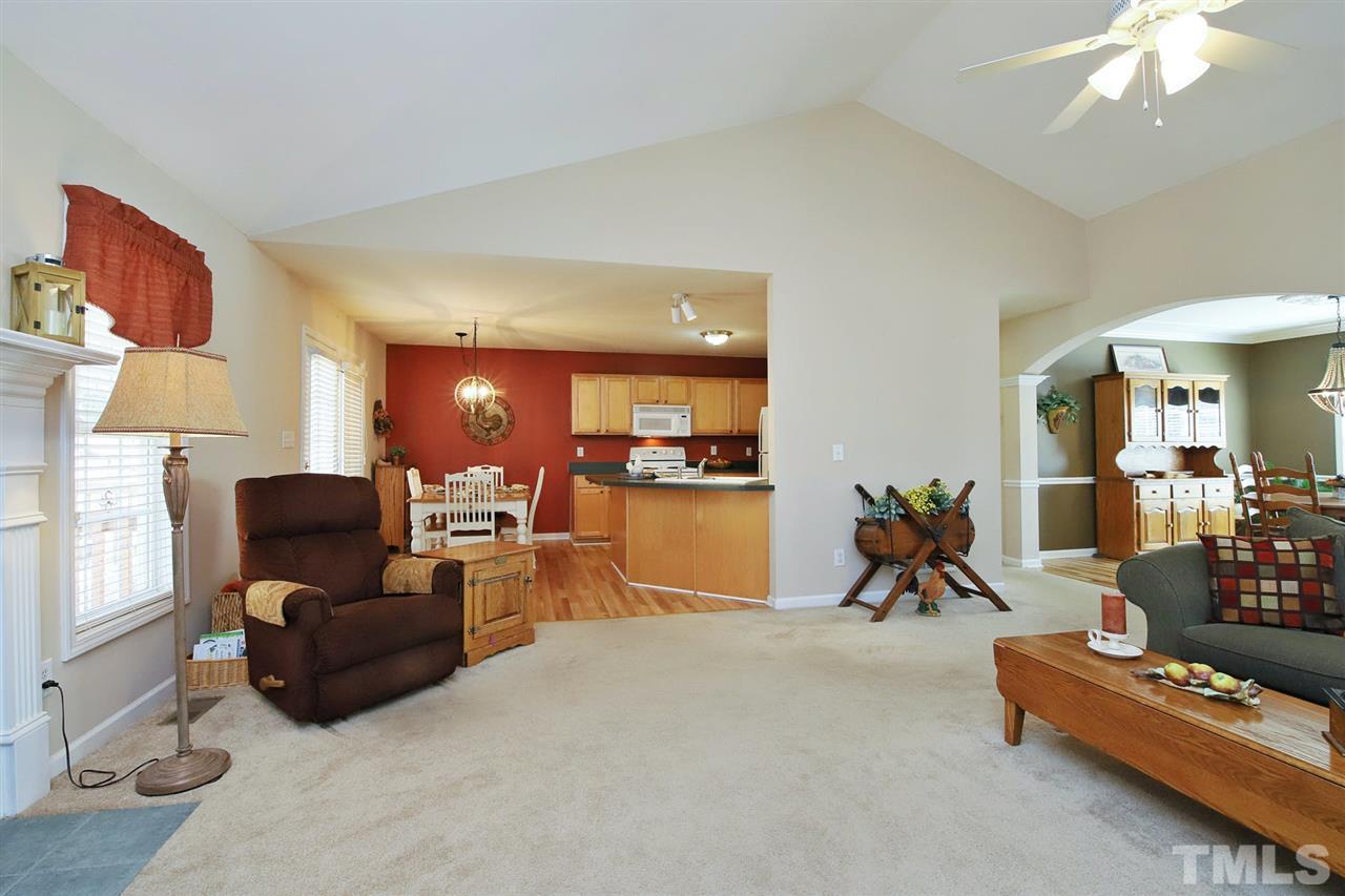 200 Melksham Road Wake Forest, NC 27587 - Photo 6 of 29 a living room with furniture a dining table and a piano table