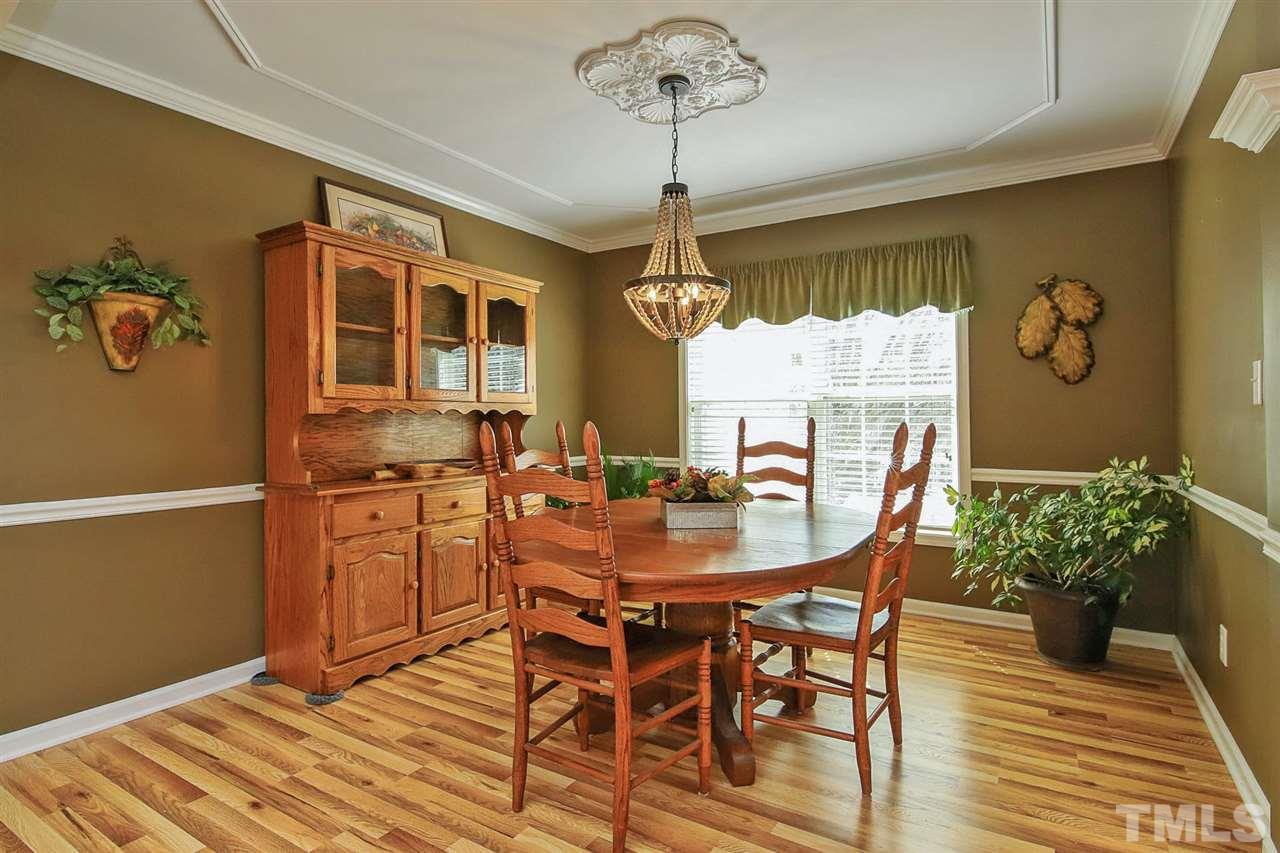 200 Melksham Road Wake Forest, NC 27587 - Photo 7 of 29 a view of a dining room with furniture window and wooden floor