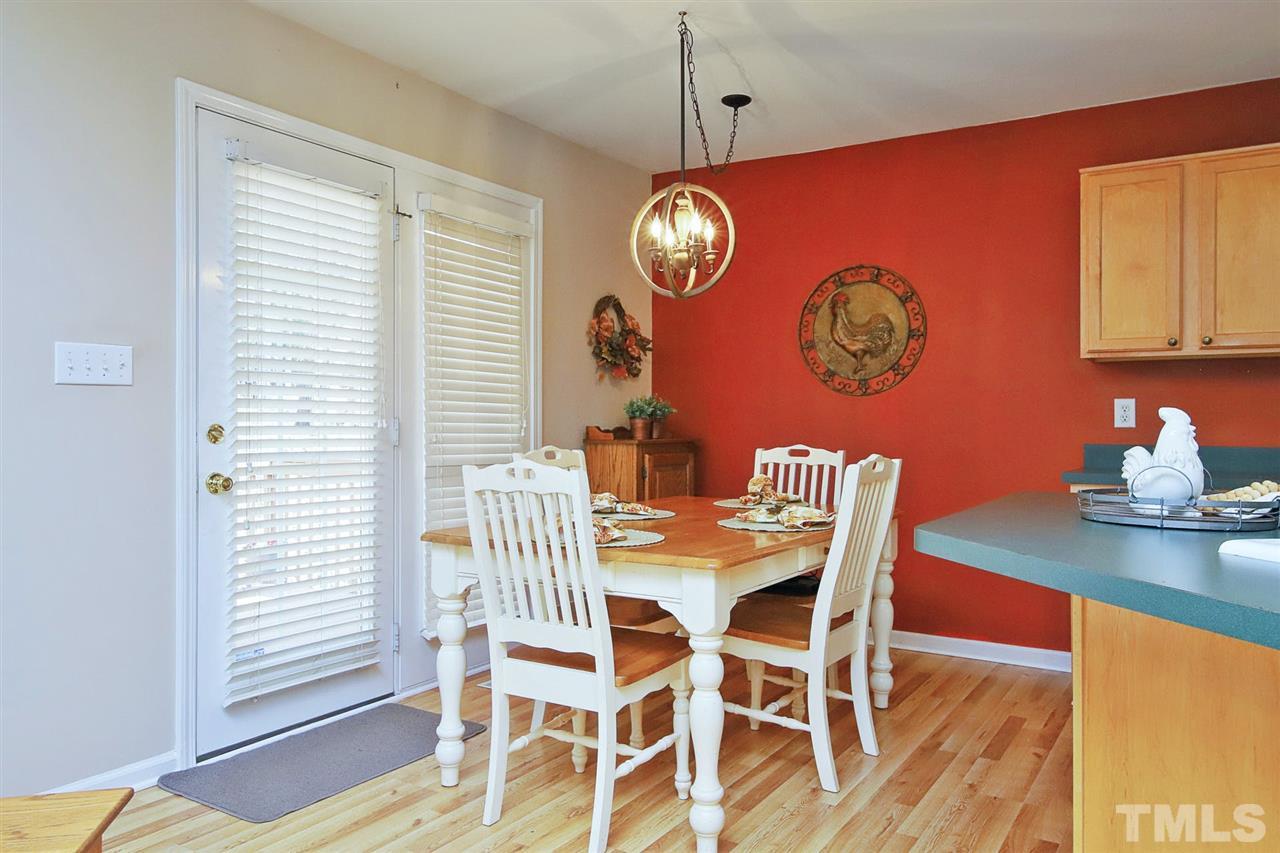 200 Melksham Road Wake Forest, NC 27587 - Photo 9 of 29 a view of a dining room with furniture and wooden floor