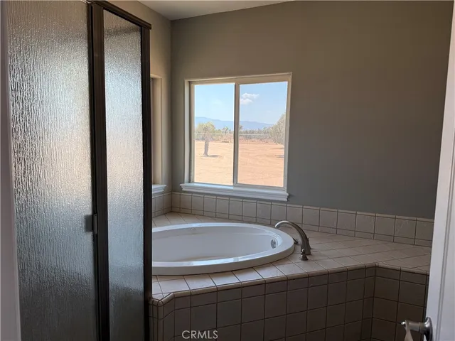 a kitchen with wooden cabinets and a sink