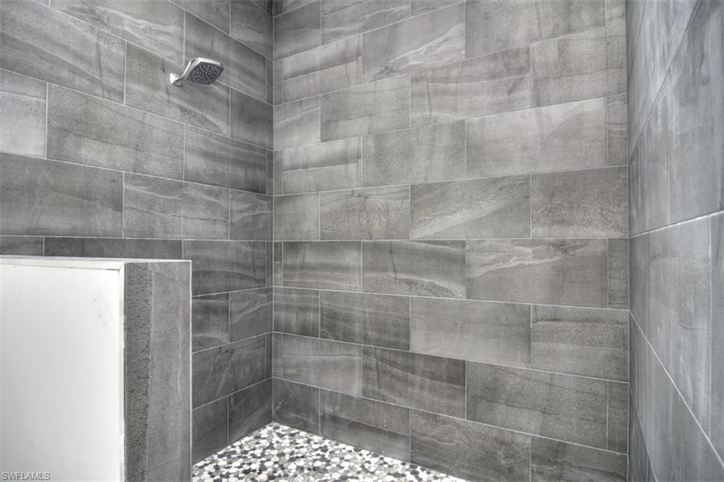 18412 Fuchsia Road Fort Myers, FL 33967 - Photo 18 of 23 a bathroom with a shower
