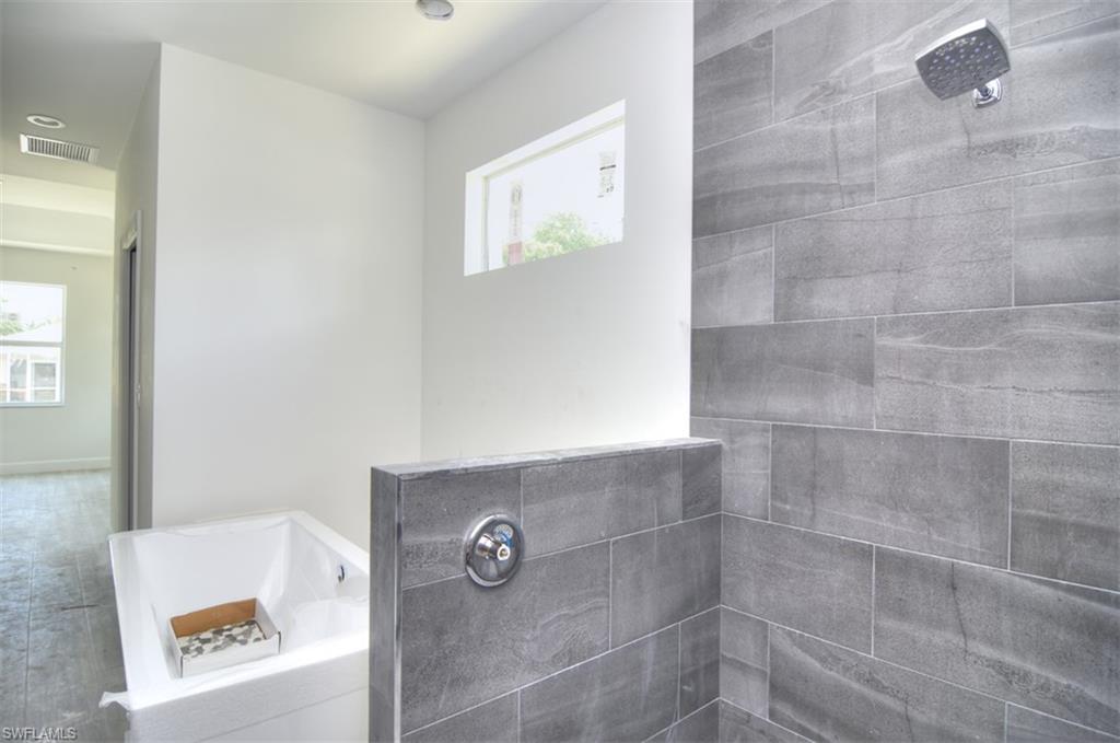18412 Fuchsia Road Fort Myers, FL 33967 - Photo 19 of 23 a bathroom with a shower