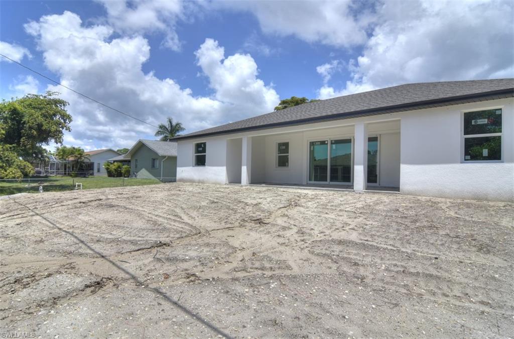 18412 Fuchsia Road Fort Myers, FL 33967 - Photo 2 of 23 a front view of a house with a yard